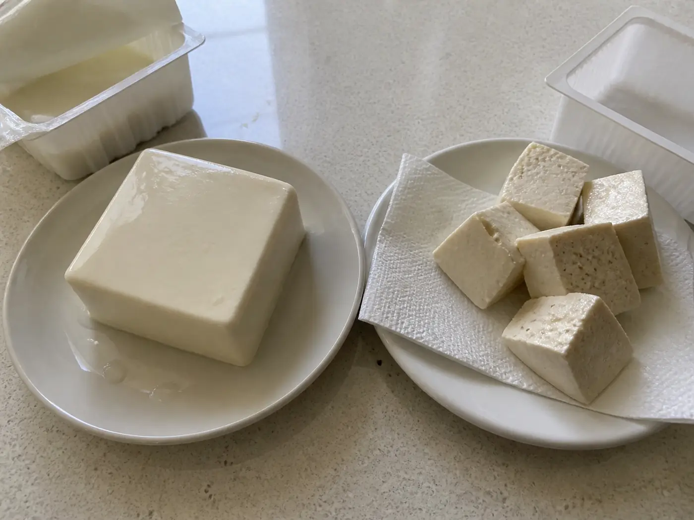 Silken tofu and firm tofu shown side by side before making soup