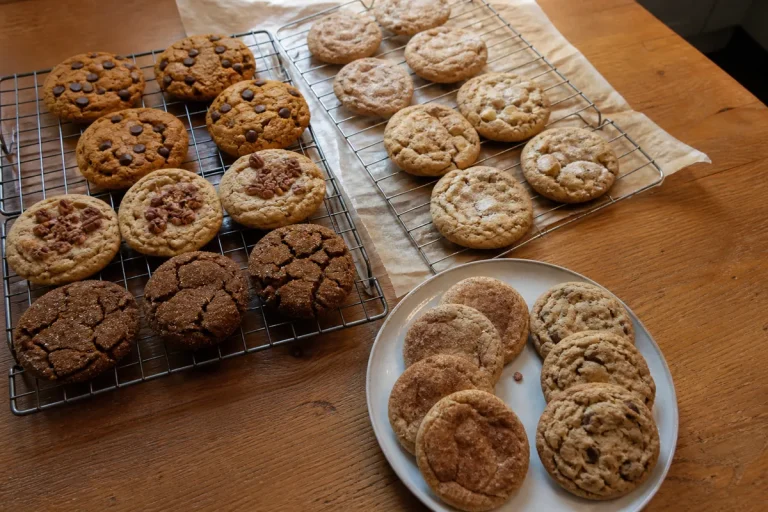 Assorted easy fall cookie recipes including pumpkin, apple, maple, spice, and chocolate cookies on cooling racks.