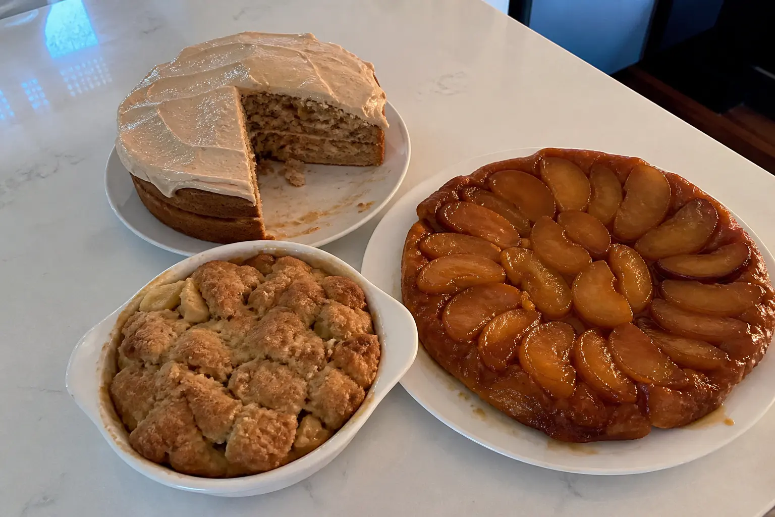 Apple cake, apple cobbler, and tarte Tatin served as Thanksgiving desserts.