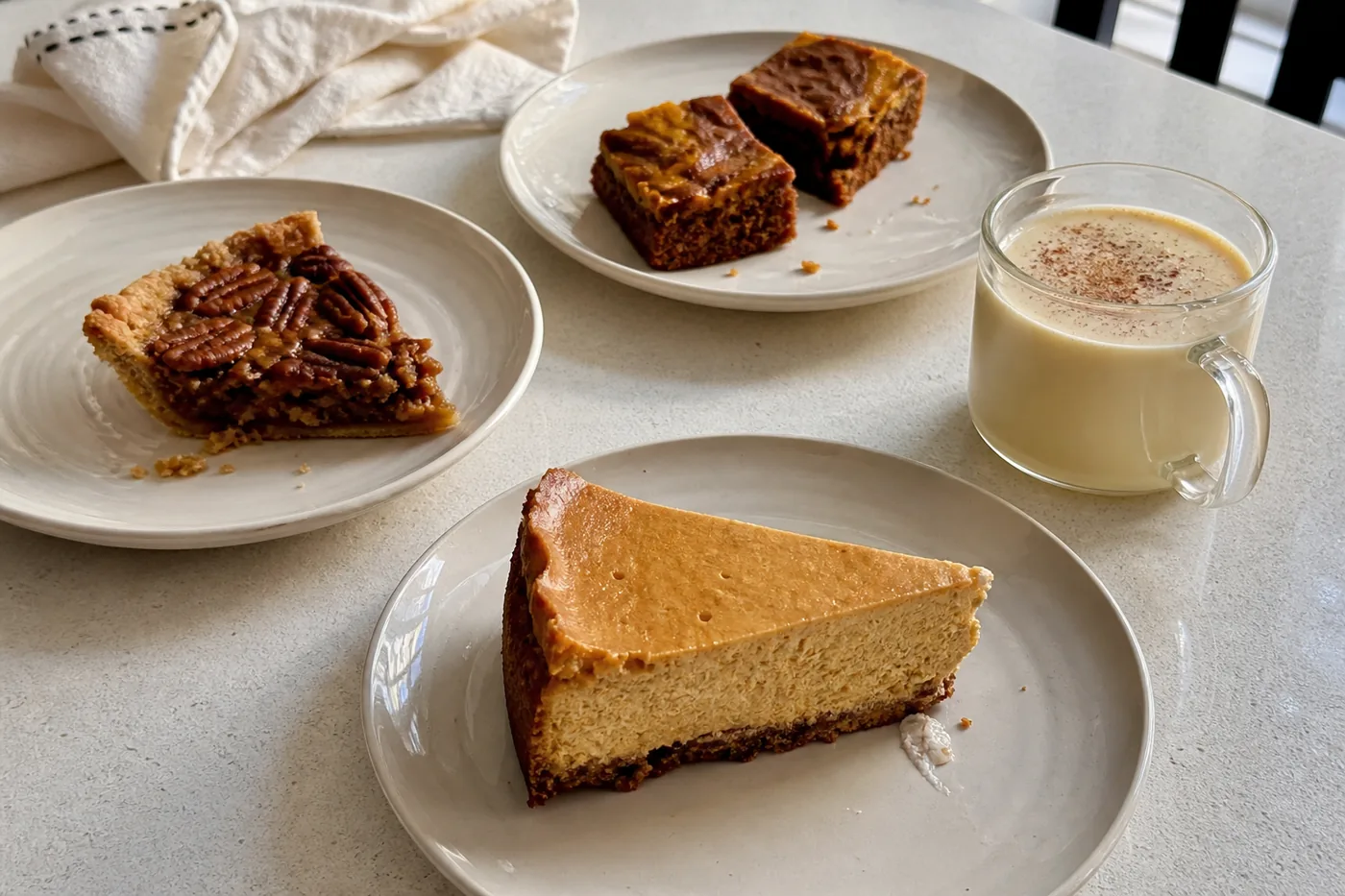 Keto pumpkin cheesecake, pecan pie, pumpkin brownies, and creamy eggnog for Thanksgiving dessert