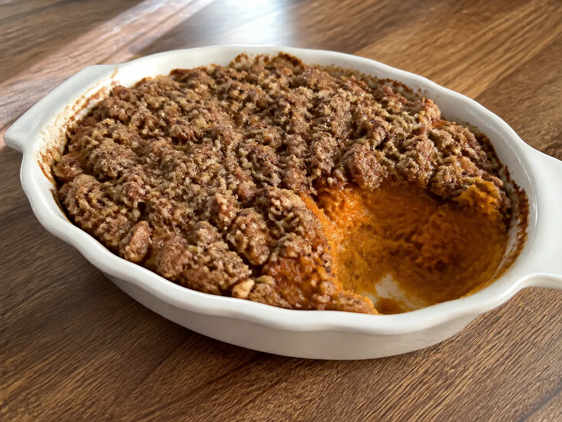 Sweet potato casserole with a browned brown sugar and pecan streusel topping