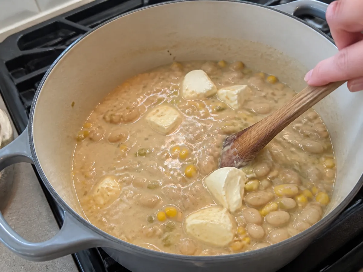 White beans, corn, green chiles, and shredded chicken simmering in creamy white chicken chili
